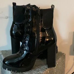 Black paten leather combat boots